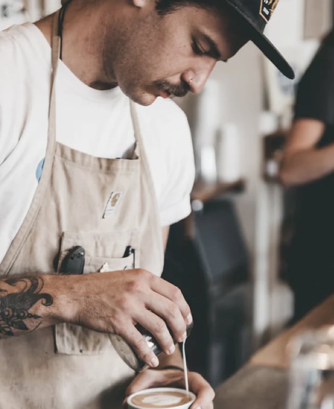 barista making coffee